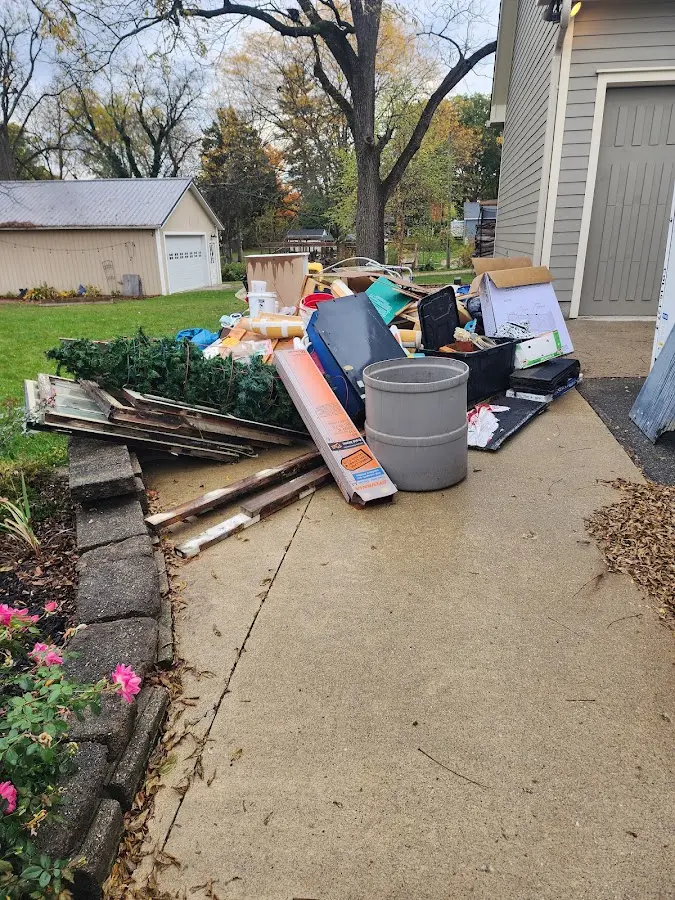 Dumpster being loaded with debris for Roofing Dumpster Rental in Checotah